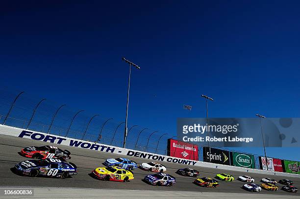 Carl Edwards, driver of the Copart.com Ford, and Kyle Busch, driver of the Z-Line Designs Toyota, lead the field during the NASCAR Nationwide Series...