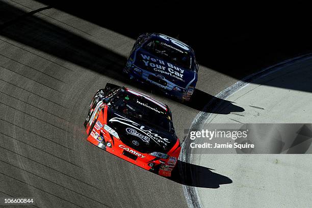 Kyle Busch, driver of the Z-Line Designs Toyota, leads Carl Edwards, driver of the Copart.com Ford, during the NASCAR Nationwide Series O'Reilly Auto...