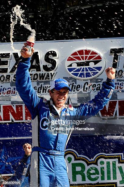 Carl Edwards, driver of the Copart.com Ford, celebrates in Victory Lane after winning the NASCAR Nationwide Series O'Reilly Auto Parts Challenge at...