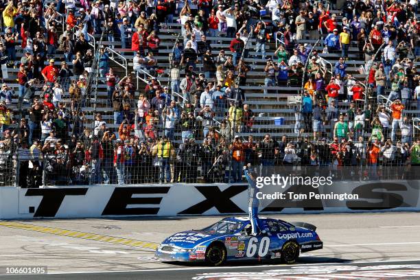 Carl Edwards, driver of the Copart.com Ford, celebrates after winning the NASCAR Nationwide Series O'Reilly Auto Parts Challenge at Texas Motor...