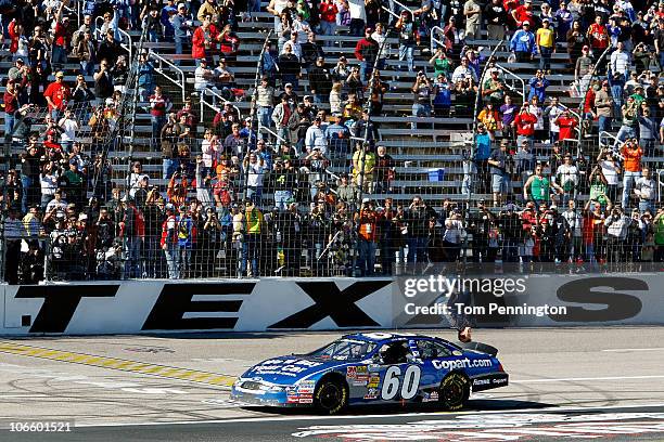 Carl Edwards, driver of the Copart.com Ford, does a back flip as he celebrates after winning the NASCAR Nationwide Series O'Reilly Auto Parts...