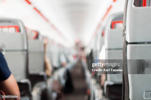 a commercial airplane interior - commercial aircraft flying stockfoto's en -beelden