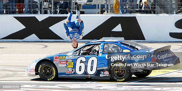 Carl Edwards back flips off of his car after winning the NASCAR Nationwide Series O�Reilly Auto Parts Challenge at Texas Motor Speedway in Fort...