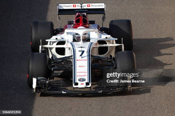 Kimi Raikkonen of Finland driving the Alfa Romeo Sauber F1 Team C37 Ferrari during day one of F1 End of Season Testing at Yas Marina Circuit on...