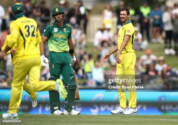 Mitchell Starc of Australia celebrates after taking the wicket of Aiden Markram of South Africa during game three of the One Day International series...