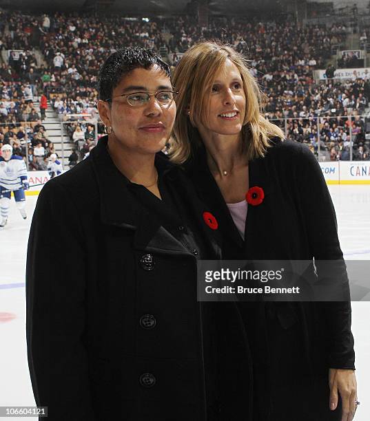 Angela James and Cammi Granato are honored for their induction into the Hockey Hall of Fame prior to the game between the Toronto Maple Leafs and the...