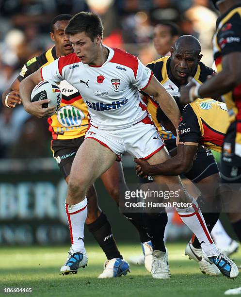 Tom Briscoe of England makes a break during the Four Nations match between England and Papua New Guinea at Eden Park on November 6, 2010 in Auckland,...