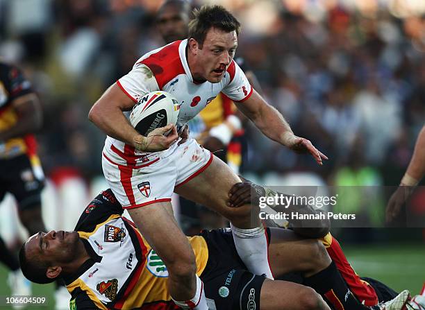 James Roby of England tries to break the line during the Four Nations match between England and Papua New Guinea at Eden Park on November 6, 2010 in...