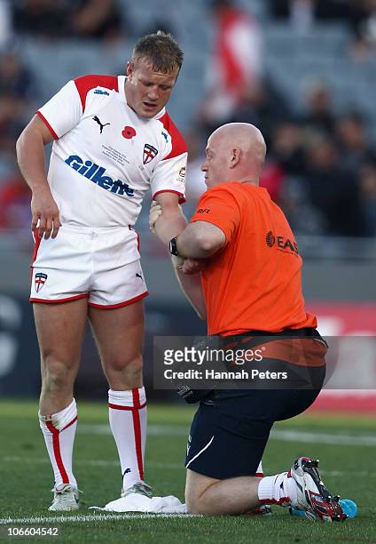 Luke Robinson of England is seen too after injuring his arm during the Four Nations match between England and Papua New Guinea at Eden Park on...