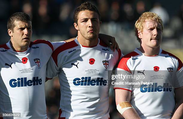 Tony Clubb, Sam Burgess and James Graham of England sing the national anthem before the Four Nations match between England and Papua New Guinea at...