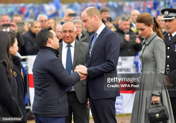Prince William, Duke of Cambridge, President of the Football Association, and Catherine, Duchess of Cambridge are greeted by Leicester City Vice...