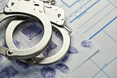 Handcuffs on fingerprints document