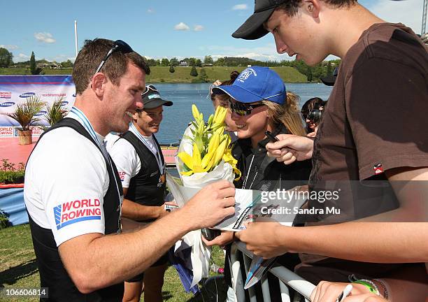 Joseph Sullivan of New Zealand signs his autograph after winning gold in the Men's Double Sculls Final during day eight of the World Rowing...