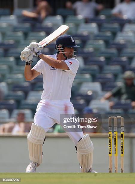 Alastair Cook of England hits out during day three of the Tour Match between the Western Australia Warriors and England at WACA on November 7, 2010...