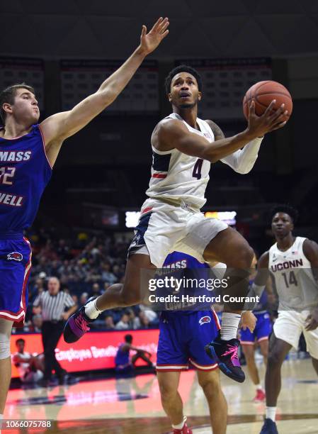 Connecticut Huskies guard Jalen Adams goes to the basket against UMass Lowell River Hawks guard Josh Gantz on Tuesday night, Nov. 27, 2018 at Gampel...