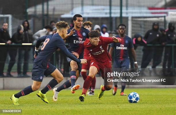 Bobby Duncan of Liverpool with Adil Aouchiche of Paris Saint-Germain on November 28, 2018 in Paris, France.