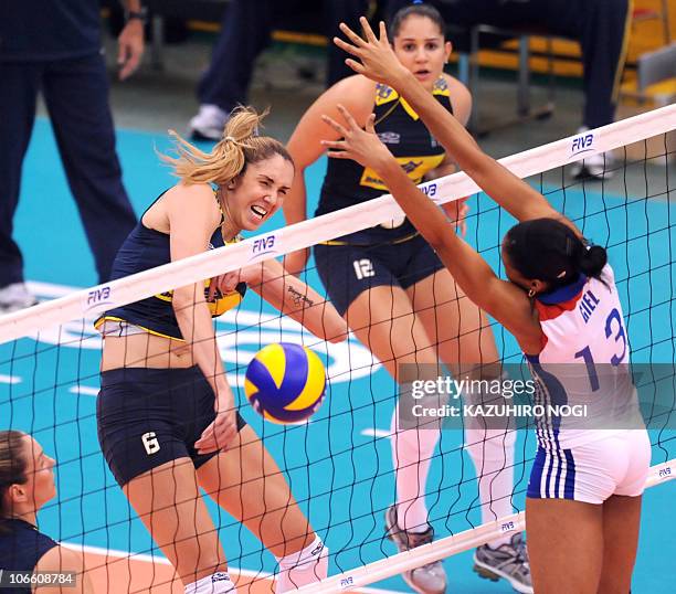 Brazil's Thaisa Menezes spikes the ball against Cuba's Rosanna Giel Ramos during their second round match at the World Women's Volleyball...