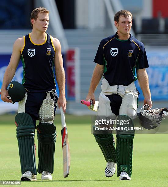 South African cricketers Colin Ingram and David Miller arrive to bat during a practice session at the Dubai Cricket Stadium on November 7, 2010....