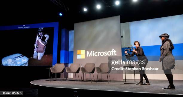 Microsoft Senior Product Marketing Manager Sohana Punithakumar demonstrates Microsoft HoloLens with a colleague during the Microsoft Annual...