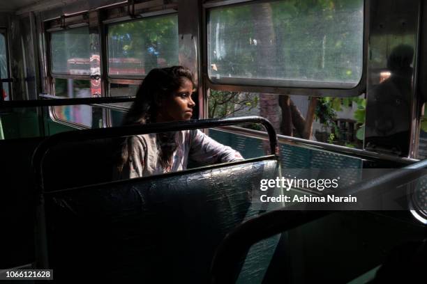 a student rides the bus to her college in mumbai - indian riding stock pictures, royalty-free photos & images