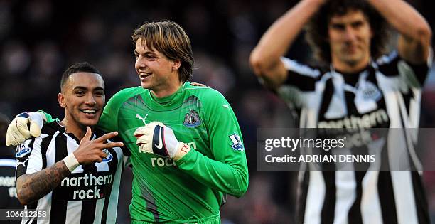 Newcastle United's English defender Danny Simpson and Dutch goalkeeper Tim Krul celebrate after beating Arsenal during the Premiership football match...