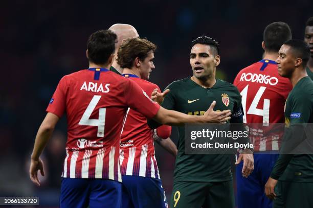 Radamel Falcao Garcia of Monaco shakes hands with Santiago Arias of Atletico Madrid following the UEFA Champions League Group A match between Club...