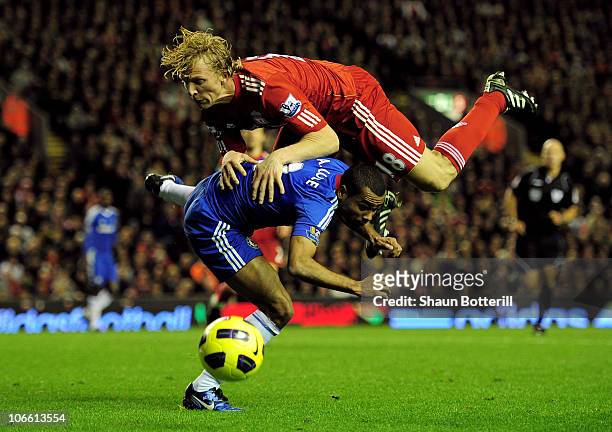 Ashley Cole of Chelsea collides with Dirk Kuyt of Liverpool during the Barclays Premier League match between Liverpool and Chelsea at Anfield on...