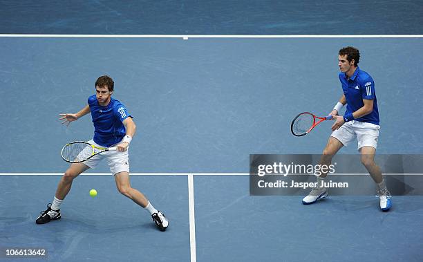 Jamie Murray of Great Britain plays a forhand flanked by his brother Andy Murray to Mahesh Bhupathi of India and Max Mirnyi of Belarus in the final...