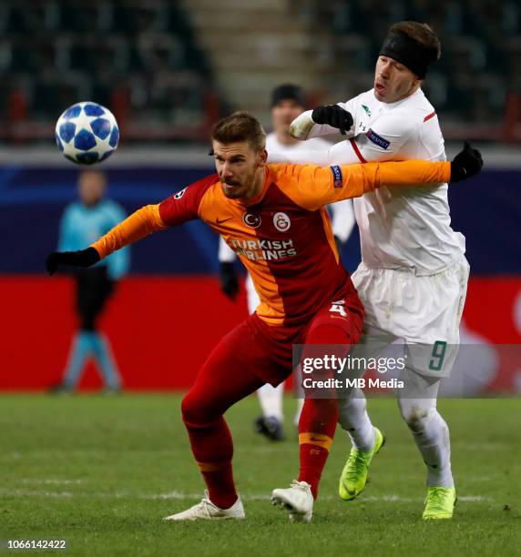 Fedor Smolov of FC Lokomotiv Moscow and Serdar Aziz of Galatasaray vie for the ball during the Group D match of the UEFA Champions League between FC...