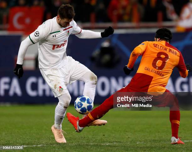 Grzegorz Krychowiak of FC Lokomotiv Moscow and Selcuk Inan of Galatasaray vie for the ball during the Group D match of the UEFA Champions League...