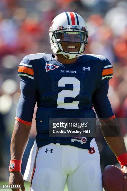 Quarterback Cam Newton of the Auburn Tigers warms up before a game against the Arkansas Razorbacks at Jordan-Hare Stadium on October 16, 2010 in...