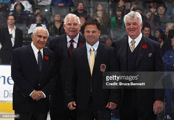 Jim Gregory, Don Hay, Dino Ciccarelli and Pat Quinn pose for photographs following the Hockey Hall of Fame blazer ceremony prior to the Legends...
