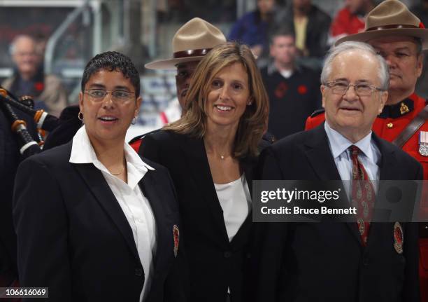 Angela James, Cammi Granato and Jimmy Devallano pose for photographs following the Hockey Hall of Fame blazer ceremony prior to the Legends Classic...