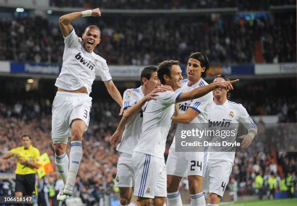 Ricardo Carvalho of Real Madrid celebrates with Pepe and Sami Khedira after scoring his team's first goal during the La Liga match between Real...