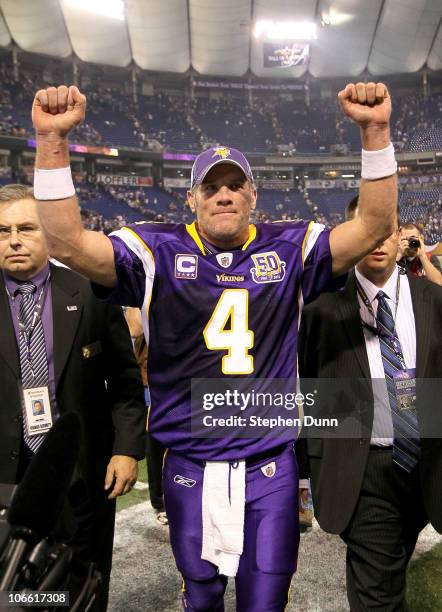 Quarterback Brett Favre of the Minnesota Vikings celebrates as he heaves the field after the game with the Arizona Cardinals at Hubert H. Humphrey...