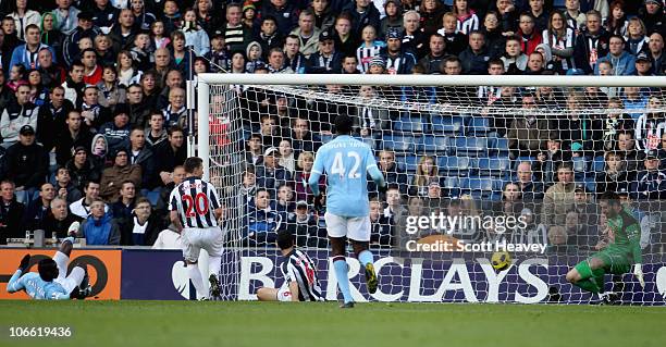 Mario Balotelli scores Manchester City's first goal during the Barclays Premier League match between West Bromwich Albion and Manchester City at The...