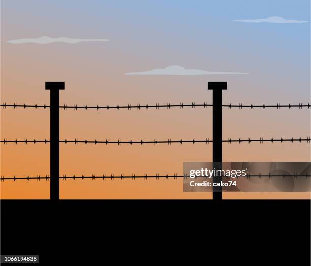 barbed wire fence - conflict zone stock illustrations