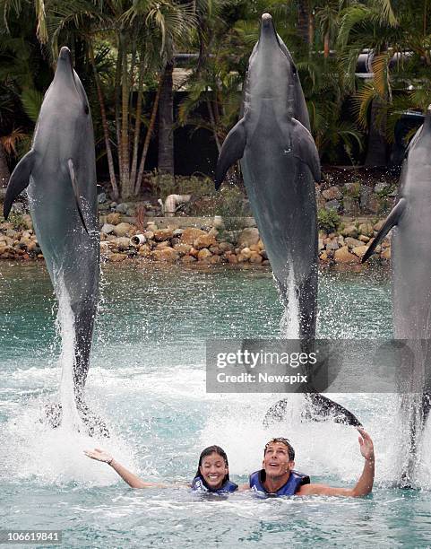 Reigning world surfing champion Andy Irons of the United States of America and girlfriend Lyndie Dupuis swins with dolphins at Sea World on March 17,...