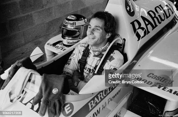 Formula One Grand Prix racing driver Gerhard Berger, driving for Arrows-BMW, sits in his car whilst waiting to compete in a qualifying session for...