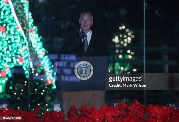 Secretary of the Interior Ryan Zinke introduces President Donald Trump during the National Christmas Tree lighting ceremony held by the National Park...
