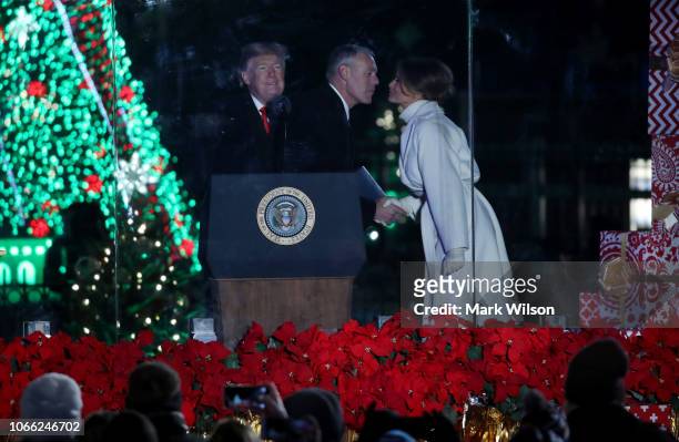 Secretary of the Interior Ryan Zinke greets First Lady Melania Trump after introducing President Donald Trump during the National Christmas Tree...