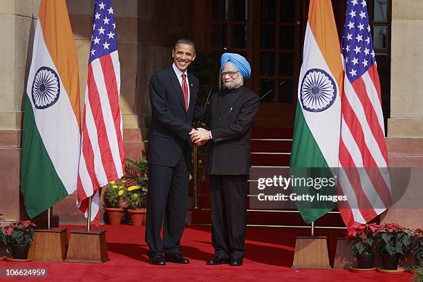 President Barack Obama shakes hands with Indian Prime Minister Manmohan Singh ahead of their meeting at Hyderabad House on November 8, 2010 in New...