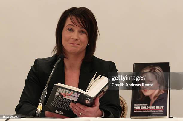 German speed skating champion Claudia Pechstein reads in her autobiography 'Of gold and blood - my life between Olympus and hell' during her book...