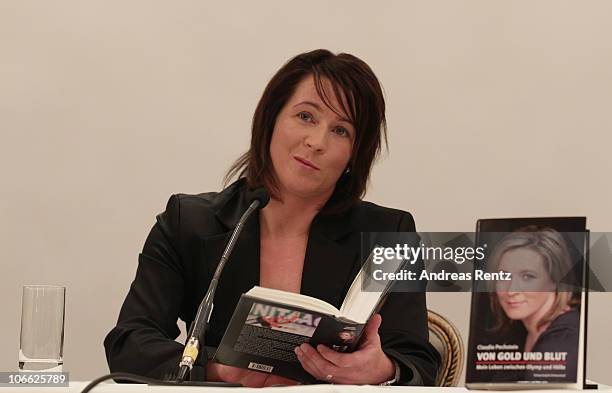 German speed skating champion Claudia Pechstein reads in her autobiography 'Of gold and blood - my life between Olympus and hell' during her book...