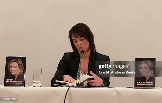 German speed skating champion Claudia Pechstein reads in her autobiography 'Of gold and blood - my life between Olympus and hell' during her book...