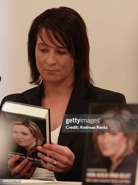 German speed skating champion Claudia Pechstein reads in her autobiography 'Of gold and blood - my life between Olympus and hell' during her book...