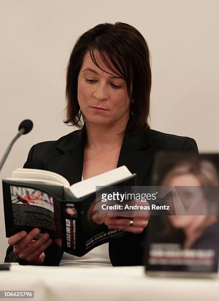 German speed skating champion Claudia Pechstein reads in her autobiography 'Of gold and blood - my life between Olympus and hell' during her book...