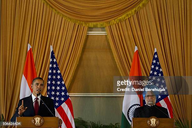 President Barack Obama addresses the media as Indian Prime Minister Manmohan Singh looks on during a joint press conference at Hyderabad House on...
