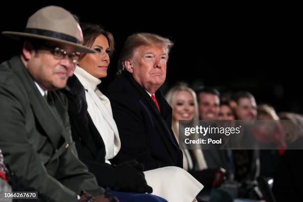 President Donald Trump, first lady Melania Trump, Interior Secretary Ryan Zinke, and Director of the National Park Service David Vela attend the...
