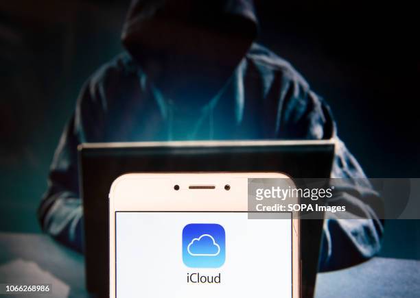 In this photo illustration, the American file hosting service company owned by Apple, Icloud, logo is seen displayed on an Android mobile device with...